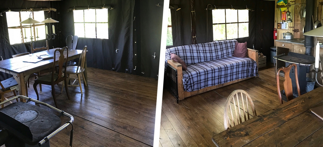 A sofa and a wooden table inside the tents at Warren Farm